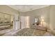 Bedroom with two twin beds, mirrored closet, and window with drapes at 275 Royal Oak Way, Venice, FL 34292