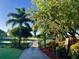 Landscaped walkway leading to a scenic golf course at 275 Royal Oak Way, Venice, FL 34292