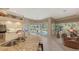 Modern kitchen with granite counters, island, and breakfast bar at 275 Royal Oak Way, Venice, FL 34292