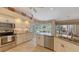 Updated kitchen with stainless steel appliances and granite countertops at 275 Royal Oak Way, Venice, FL 34292