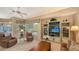 Spacious living room with large windows and ample natural light at 275 Royal Oak Way, Venice, FL 34292