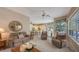 Bright living room with views into kitchen and pool area at 275 Royal Oak Way, Venice, FL 34292