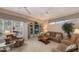 Relaxing living room with comfortable seating and built-in entertainment center at 275 Royal Oak Way, Venice, FL 34292
