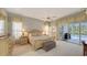 Large main bedroom with ensuite bathroom and private access to the pool at 275 Royal Oak Way, Venice, FL 34292