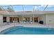 Inviting pool area with screened enclosure and patio at 275 Royal Oak Way, Venice, FL 34292