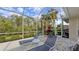 Screened patio with lounge chairs near pool at 275 Royal Oak Way, Venice, FL 34292