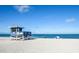 Lifeguard stand and beachgoers enjoying the beautiful white sand beach at 340 Bermuda Ct # 5, Venice, FL 34293