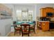 Kitchen breakfast nook with built-in seating and charming decor at 340 Bermuda Ct # 5, Venice, FL 34293