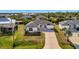 Aerial view of a single-Gathering house with a driveway and landscaped yard at 3436 Santa Clara Dr, Punta Gorda, FL 33983