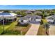 Aerial view of a single-Gathering home with a driveway and landscaped yard at 3436 Santa Clara Dr, Punta Gorda, FL 33983