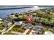 An aerial view shows waterfront homes with well-kept lawns, private docks, and easy access to the river at 3436 Santa Clara Dr, Punta Gorda, FL 33983