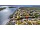 Aerial view showcasing the home's waterfront location and surrounding neighborhood at 3436 Santa Clara Dr, Punta Gorda, FL 33983