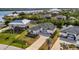 Aerial view of a single-Gathering home with a driveway and landscaped yard at 3436 Santa Clara Dr, Punta Gorda, FL 33983