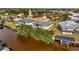 Aerial view of a waterfront property with a pool and private dock at 3436 Santa Clara Dr, Punta Gorda, FL 33983