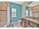 Clean bathroom with teal walls, granite vanity, and a bathtub shower combo at 3436 Santa Clara Dr, Punta Gorda, FL 33983