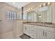 Elegant bathroom with granite countertops, double vanity, and walk-in shower at 3436 Santa Clara Dr, Punta Gorda, FL 33983