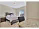 Bedroom with a double bed, nightstand and built-in desk with granite top at 3436 Santa Clara Dr, Punta Gorda, FL 33983