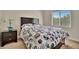 Cozy bedroom with a double bed, nightstand, and window coverings at 3436 Santa Clara Dr, Punta Gorda, FL 33983