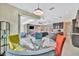 Kitchen and dining area with colorful chairs and view of the living room at 3436 Santa Clara Dr, Punta Gorda, FL 33983