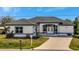 White house with gray accents and a paved driveway at 3436 Santa Clara Dr, Punta Gorda, FL 33983