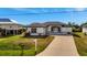 White house with gray accents and a paved driveway at 3436 Santa Clara Dr, Punta Gorda, FL 33983