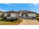 White house with gray accents and a paved driveway at 3436 Santa Clara Dr, Punta Gorda, FL 33983