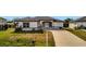 White house with gray accents and a paved driveway at 3436 Santa Clara Dr, Punta Gorda, FL 33983