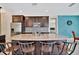 Gourmet kitchen with granite island and stylish dark cabinetry at 3436 Santa Clara Dr, Punta Gorda, FL 33983