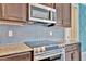 Stainless steel appliances and granite countertops in this modern kitchen at 3436 Santa Clara Dr, Punta Gorda, FL 33983