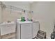 Laundry room with washer, dryer, utility sink, and shelving at 3436 Santa Clara Dr, Punta Gorda, FL 33983