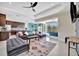 Open concept living room with kitchen and pool access at 3436 Santa Clara Dr, Punta Gorda, FL 33983