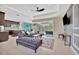 Open living space with comfortable seating and large TV at 3436 Santa Clara Dr, Punta Gorda, FL 33983