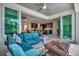 Covered patio with fire pit and comfortable seating, overlooking kitchen and living area at 3436 Santa Clara Dr, Punta Gorda, FL 33983