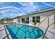 Spacious screened pool with expansive backyard and canal views at 3436 Santa Clara Dr, Punta Gorda, FL 33983