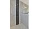 Spacious shower with marble tile and mosaic accent at 3436 Santa Clara Dr, Punta Gorda, FL 33983