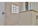 Walk-in shower with marble tile and glass enclosure at 3436 Santa Clara Dr, Punta Gorda, FL 33983