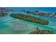 Aerial view of island with boats in turquoise water at 3667 Yellow Pine Ct # 149, Sarasota, FL 34238