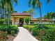 Community clubhouse with inviting walkway and landscaping at 3667 Yellow Pine Ct # 149, Sarasota, FL 34238