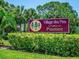 Village des Pins Pinetree community entrance sign at 3667 Yellow Pine Ct # 149, Sarasota, FL 34238