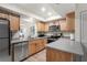 Modern kitchen with stainless steel appliances and light wood cabinets at 3667 Yellow Pine Ct # 149, Sarasota, FL 34238