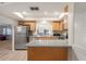 Modern kitchen with stainless steel appliances and light wood cabinets at 3667 Yellow Pine Ct # 149, Sarasota, FL 34238