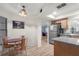 Kitchen with light wood cabinets, stainless steel appliances, and breakfast nook at 3667 Yellow Pine Ct # 149, Sarasota, FL 34238