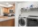 Laundry room with washer, dryer, and ample shelf space at 3667 Yellow Pine Ct # 149, Sarasota, FL 34238
