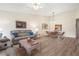 Open living and dining area with wood floors and light walls at 3667 Yellow Pine Ct # 149, Sarasota, FL 34238