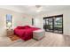 Spacious main bedroom with sliding glass doors leading to patio at 3667 Yellow Pine Ct # 149, Sarasota, FL 34238