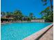 Community swimming pool with spacious deck area at 3667 Yellow Pine Ct # 149, Sarasota, FL 34238