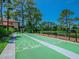 Dual shuffleboard courts situated beside a pond at 3667 Yellow Pine Ct # 149, Sarasota, FL 34238