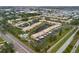 High-angle view of the condo complex and location in the neighborhood, near roads, and community amenities at 380 Three Lakes Ln # E, Venice, FL 34285