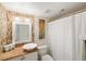 Modern bathroom with tiled walls, vessel sink, and updated fixtures at 380 Three Lakes Ln # E, Venice, FL 34285
