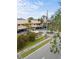 Community entrance with sign and American flag at 380 Three Lakes Ln # E, Venice, FL 34285
